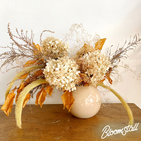 Modern, Ceramic Sphere Vase Filled with Dried Flowers, Foliage, and Grasses.