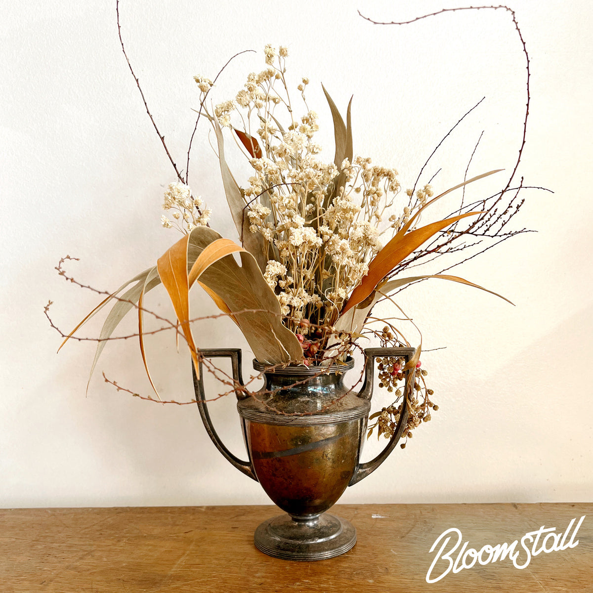 Wild, dried flower and foliage arrangement in Antique Metal Urn - Small